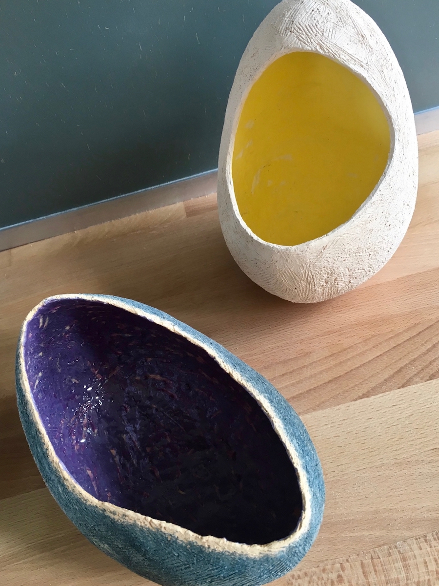 2 Egg like pots with coloured interiors