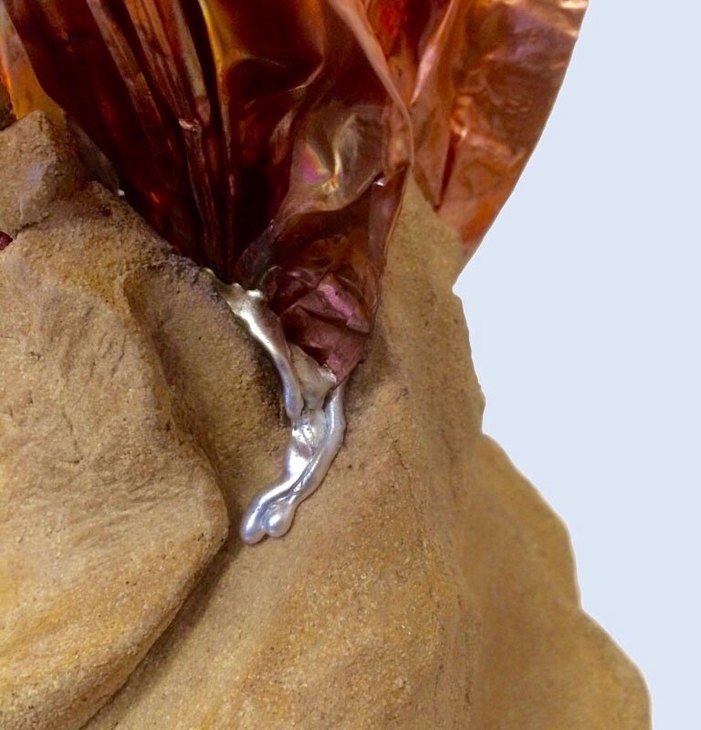 Detaile view of Viva showing pewter dripping from place where copper arises from the stoneware base.