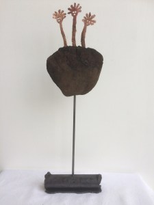 From when we came. Small sculpture of 3 Copper Mimi on peat. 2017